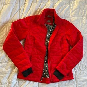 Hot red insulated jacket with thumb holes and pockets